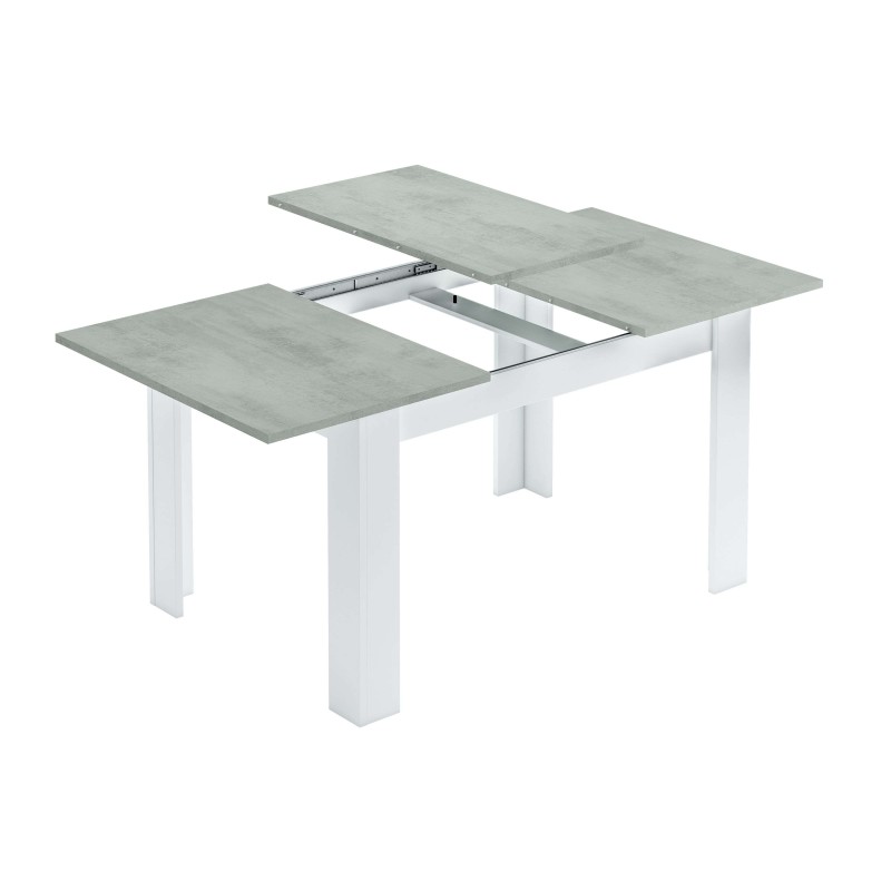 Mesa extensible con tablero efecto hormigón gris y estructura blanca con sistema de extensión visible
