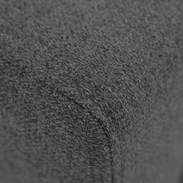 Detalle de tapizado en tela gris con textura tejida y patrón de punto