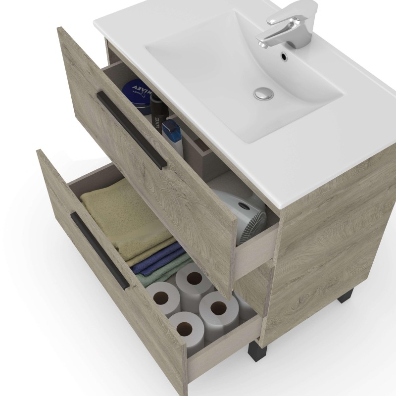 Mueble bajo lavabo de madera clara con cajones abiertos y lavamanos blanco integrado vista de almacenamiento