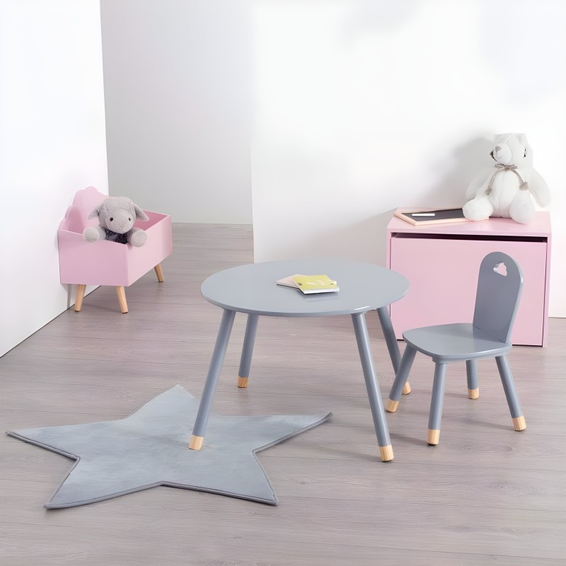 Conjunto infantil de muebles con mesa redonda gris y silla gris patas madera cajas almacenaje rosa y alfombra estrella azul