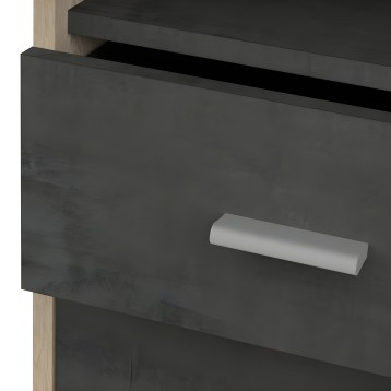 Detalle de cajonera negra con tirador cilíndrico plateado y patas de madera clara