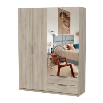 Armario de madera clara con puertas espejo y cajones inferiores en ambiente de dormitorio