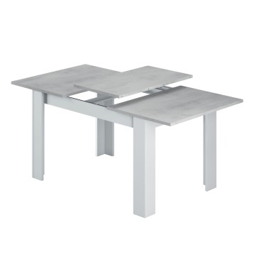 Mesa extensible con tablero gris hormigón y estructura blanca con patas cuadradas y sistema de prolongación central