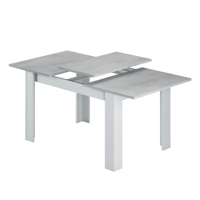 Mesa extensible con tablero gris hormigón y estructura blanca con patas cuadradas y sistema de prolongación central