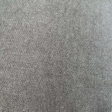 Detalle de tapizado en tela gris claro con textura de tejido grueso y trama uniforme